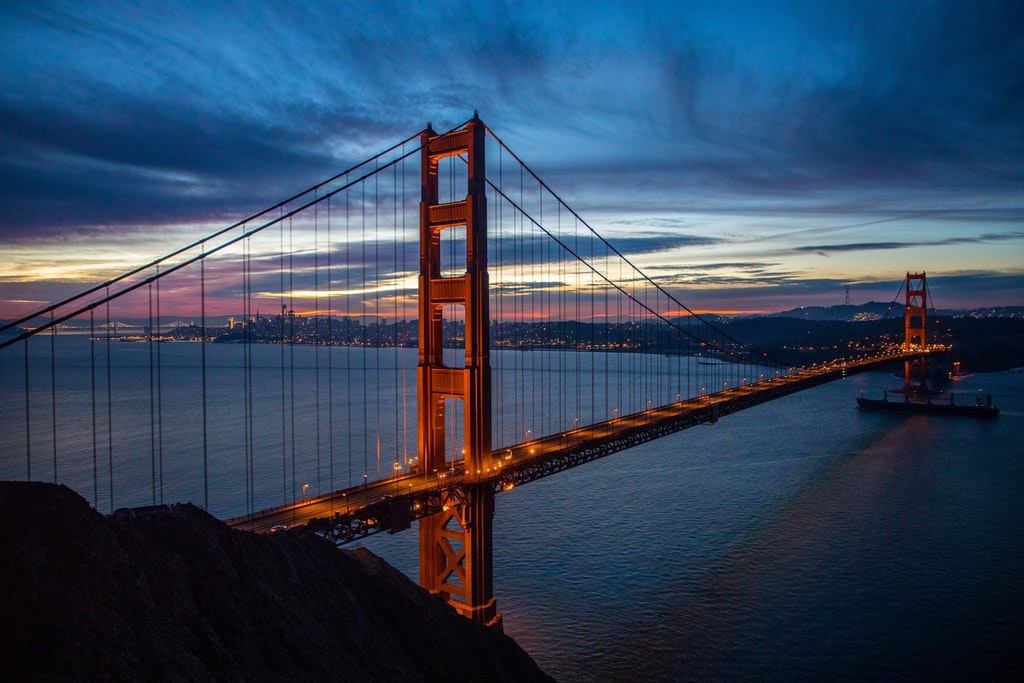 The golden gate bridge at sunrise.